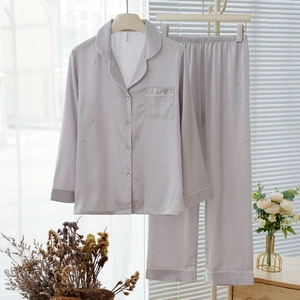 Silver ice silk pajama set for women with long sleeves and shimmering star pattern