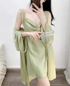 Detailed view of light green satin nightgown and long sleeve robe set with silk texture