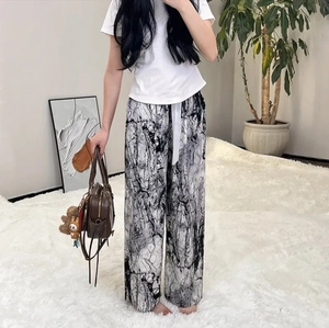 Detail of loose fit marble print pajama pants with adjustable drawstring waist for women
