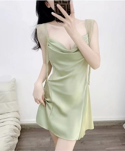 Detail of light green satin chemise featuring a cowl neck and sheer mesh strap inserts