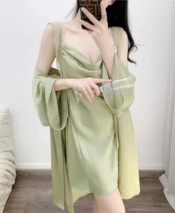 Close-up of light green silk satin pajamas with lace V-neck dress and long sleeve robe