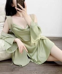 Detail of light green silk pajama set with draped slip dress and matching long sleeve cardigan