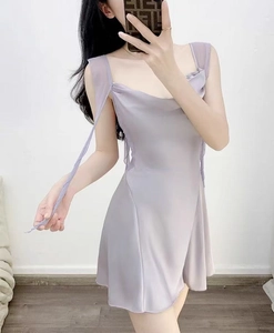 Detail of lavender satin slip dress featuring elegant cowl neck and decorative shoulder ribbons