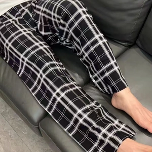 Relaxed fit black and white plaid pajama pants for men and women in lightweight cotton fabric