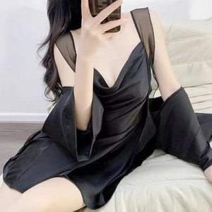Women's black satin sleepwear set featuring a slip dress and matching cardigan robe