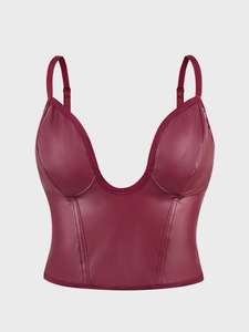 Detail of the glossy burgundy corset camisole featuring vertical seams and shoulder straps