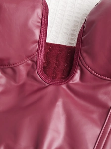 Close-up of burgundy PU leather corset top with velvet panels and button fasteners