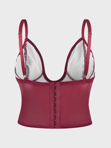 Detail of burgundy slimming camisole showing front hook-and-eye closure and adjustable straps