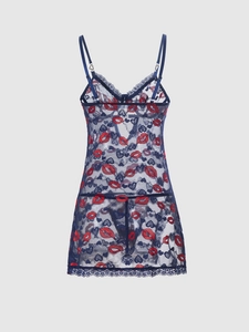 Detail of blue lace lingerie with red lip and heart embroidery and floral trim