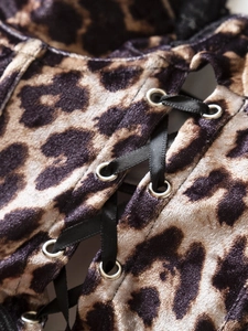 Detail of Y2K leopard velvet camisole showing corset lace-up ties and metal eyelets
