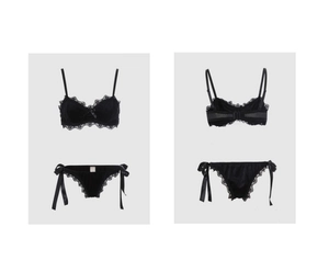 Detail view of black lace trim bra and side-tie panties set with satin finish