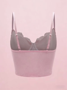 Rear view of pink lace corset top showing smooth satin fabric and adjustable straps