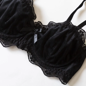 Sexy black velvet lingerie set with floral lace trim and elegant satin bow details