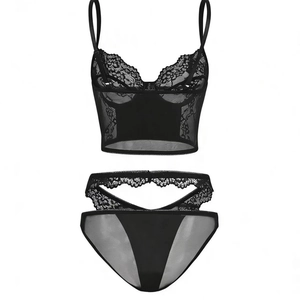 Detail view of gothic style PU lace patchwork lingerie set with criss-cross waist straps