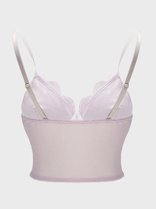 Detail of light purple lace corset with sheer mesh panels and adjustable straps
