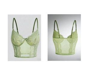 Detailed view of light green lace corset top with floral embroidery and mesh paneling