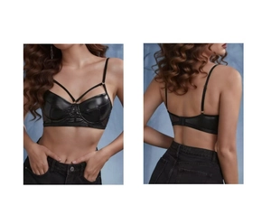 Détail d'un bustier en cuir PU noir avec lanières croisées et empiècement en mesh