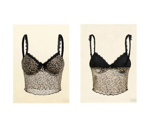 Detail view of leopard print camisole featuring black lace trim and bow accent