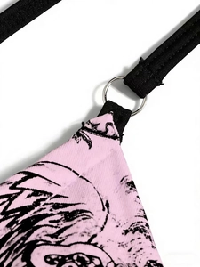 Macro detail of pink bikini with anime print, black strap and silver metal ring connector