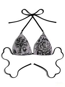 Detailed view of grey bikini top with gothic cross and rose prints and black tie-straps