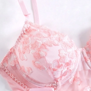 Pink mesh camisole top featuring floral embroidery and adjustable straps for women