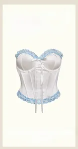 Detail view of the French white bustier with blue lace trim and bow knot decor
