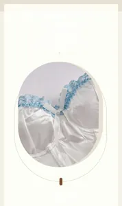 Detailed view of white satin corset top with light blue lace trim and bow knot detailing
