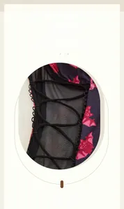 Close-up of Halloween bat print fabric with lace mesh and adjustable criss-cross lacing