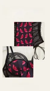 Close-up of Halloween bat print, lace trim and lace-up details on purple shapewear