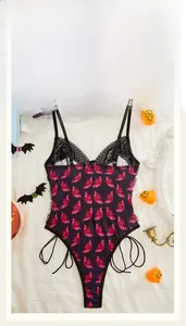 Detail of Halloween lace bodysuit featuring pink bat prints and side lace-up design