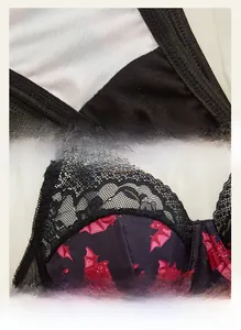 Detail of Halloween lace bodysuit featuring red bat prints and fine mesh stitching