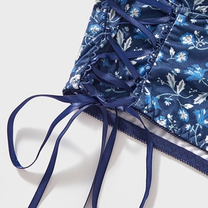 Floral print lace-up bustier corset top with blue satin straps and scalloped edges