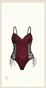 Detail of red and black bodysuit featuring spiderweb lace, underwire support, and side lacing