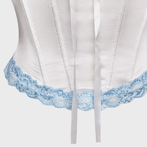 Elegant white satin corset with light blue lace trim and ribbon detailing on flat background