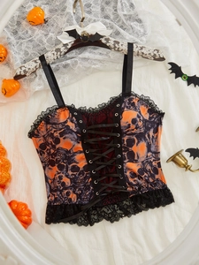 Close-up of Halloween camisole with skull print, lace trim and front ribbon lacing