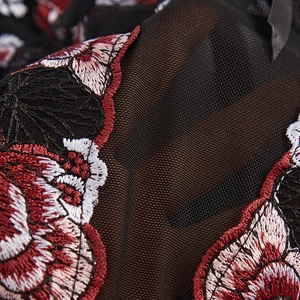 Sexy black mesh corset top with red floral embroidery and boning structure detail