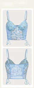 Detailed front and back views of light blue floral embroidered mesh corset top with straps
