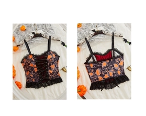 Detail view of Halloween corset top featuring skull print, lace trim and front lacing