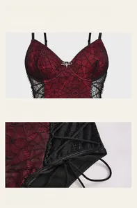 Detail of red lace spiderweb pattern with bat cross pendant and side lace-up design