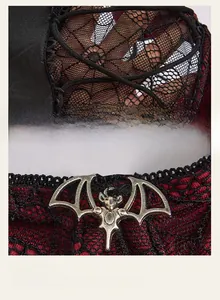 Close-up of gothic velvet bodysuit with black lace overlay and bat metal pendant detail