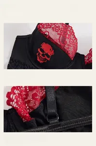 Detail of red lace trim and skull print on a sexy black and red gothic bra