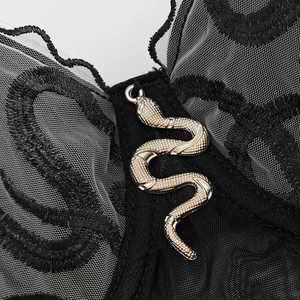 Black lace corset top with mesh embroidery and a silver snake charm detail on the front