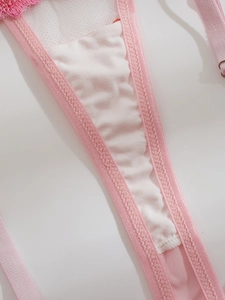 Close-up of pink mesh lingerie with delicate lace embroidery and soft cotton lining