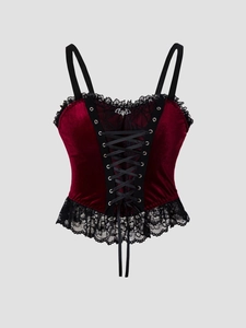 Gothic burgundy velvet corset top with black lace trim and metal bat pendant detail