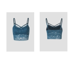 Detail of floral lace texture and cross strap back design on dark teal camisole