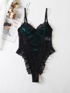 Detail of dark green velvet bodysuit with black lace trim and delicate spaghetti straps
