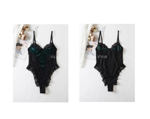 Detailed view of dark green velvet bodysuit with delicate black eyelash lace and thin straps