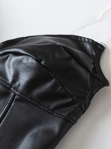 Close-up of black PU leather punk corset featuring fine stitching and clear straps