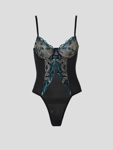 Detailed embroidery view of floral patterns on black lace bodysuit for women