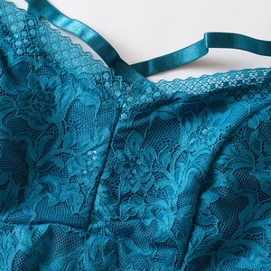 Deep teal lace camisole top with floral embroidery and satin straps on white background